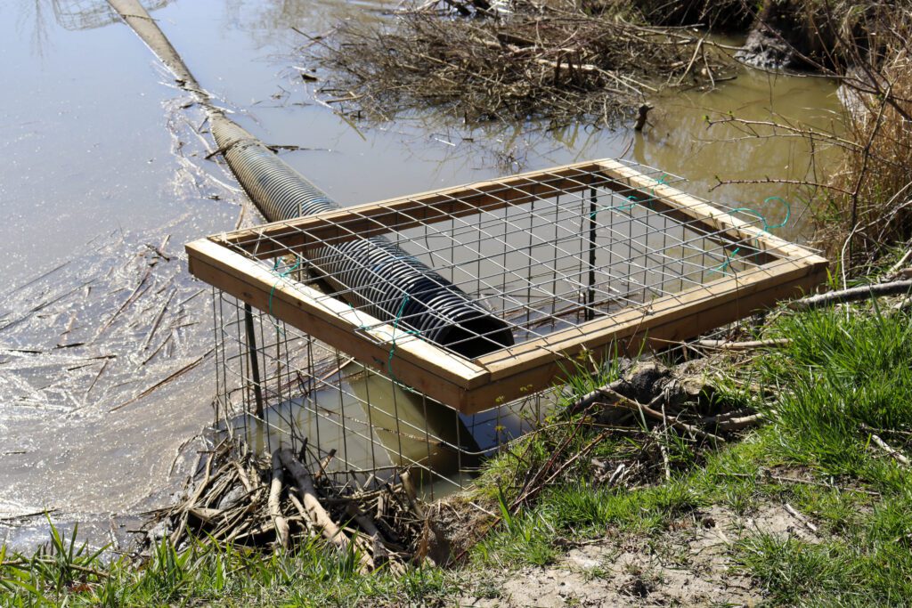 Humane Solutions Beaver Combo Device, featuring a pond leveler and beaver exclusion fence.